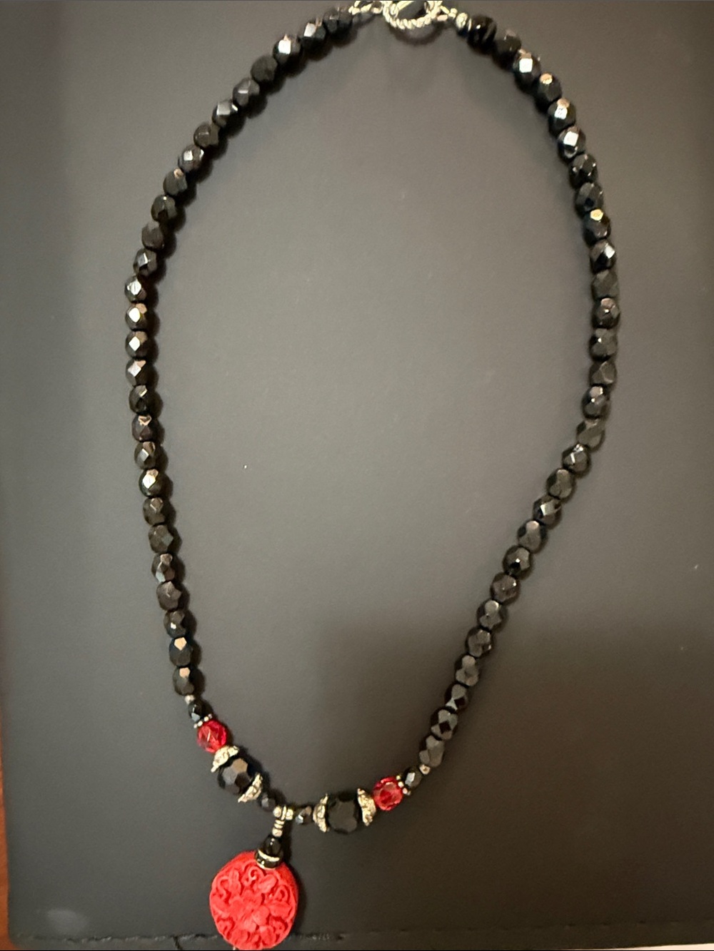 Handcrafted Black Beaded Necklace with hand carved Red Pendant